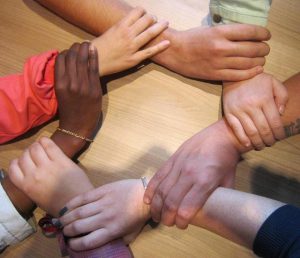 hands-different-races-holding-wrists (1)